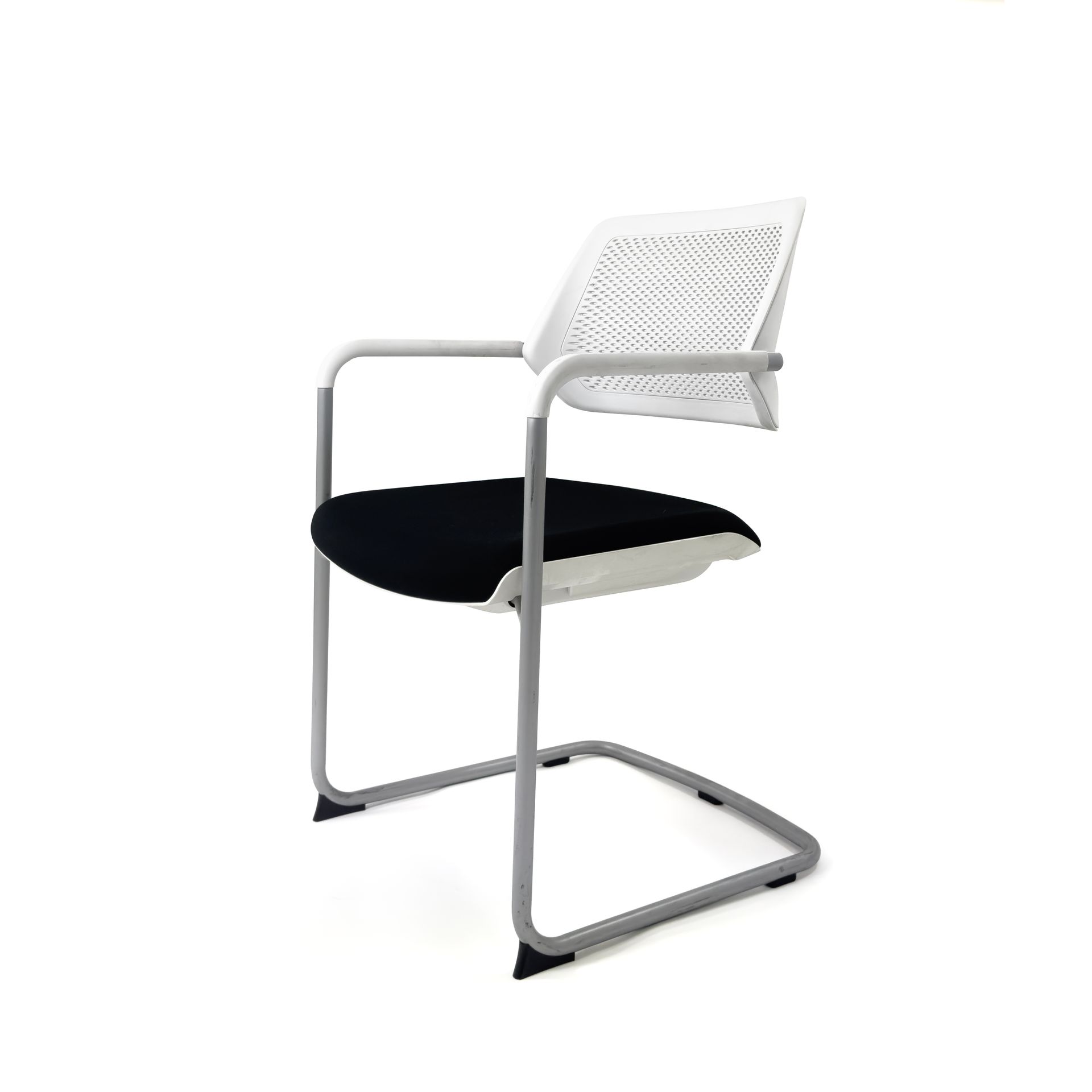 White mesh back chair with black seat and grey frame.