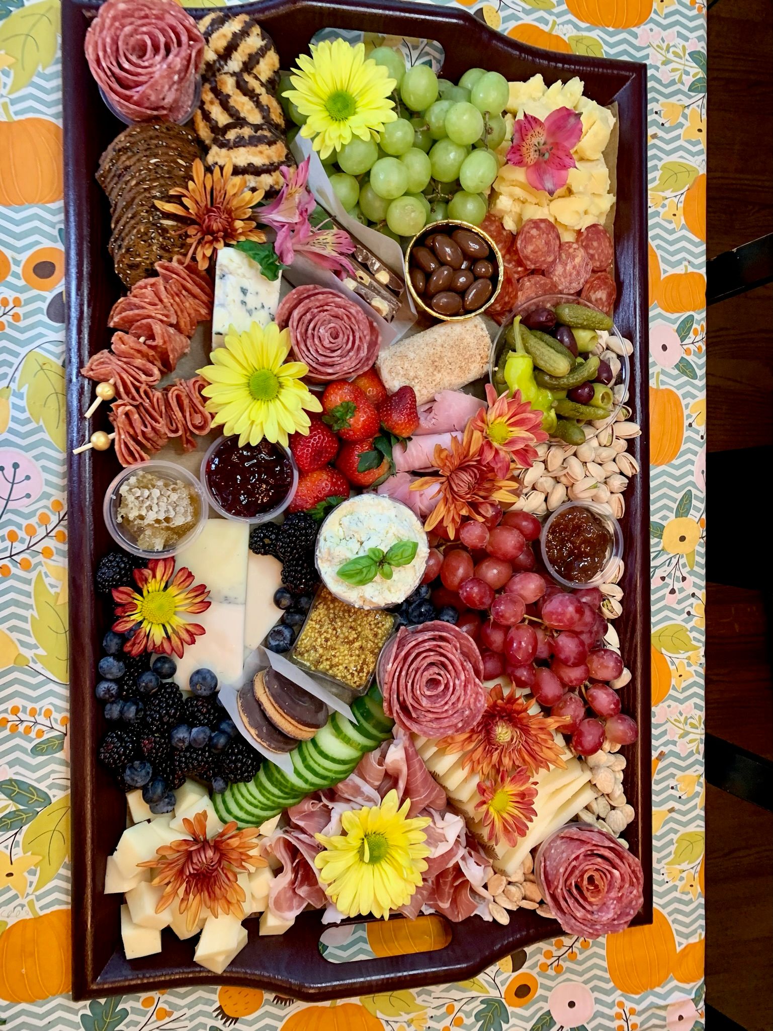 A large tray of food is sitting on a table.