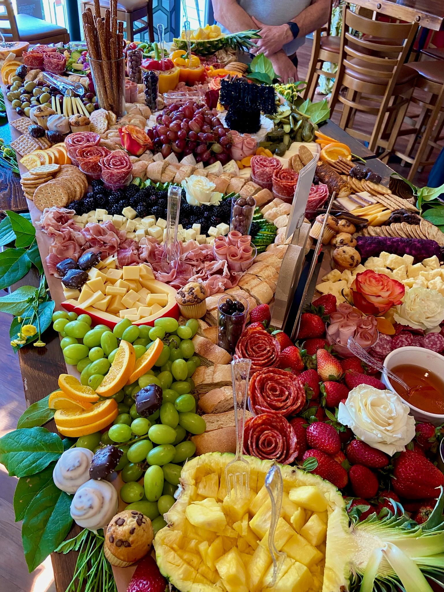 A large table topped with a variety of fruits and vegetables.