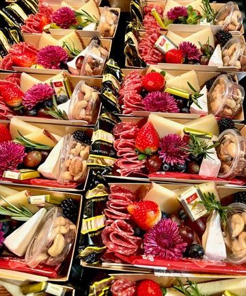 There are many different types of food in the boxes.
