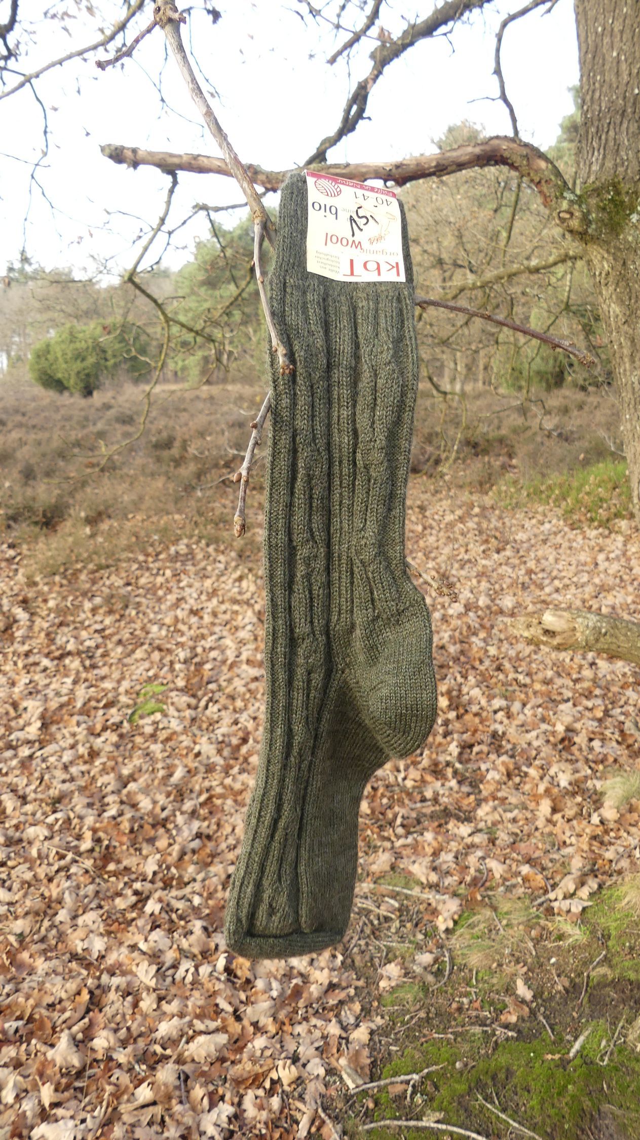 Wool socks knitted in a decorative hunter green pattern