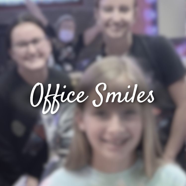 A blurry picture of a girl with the words office smiles above her