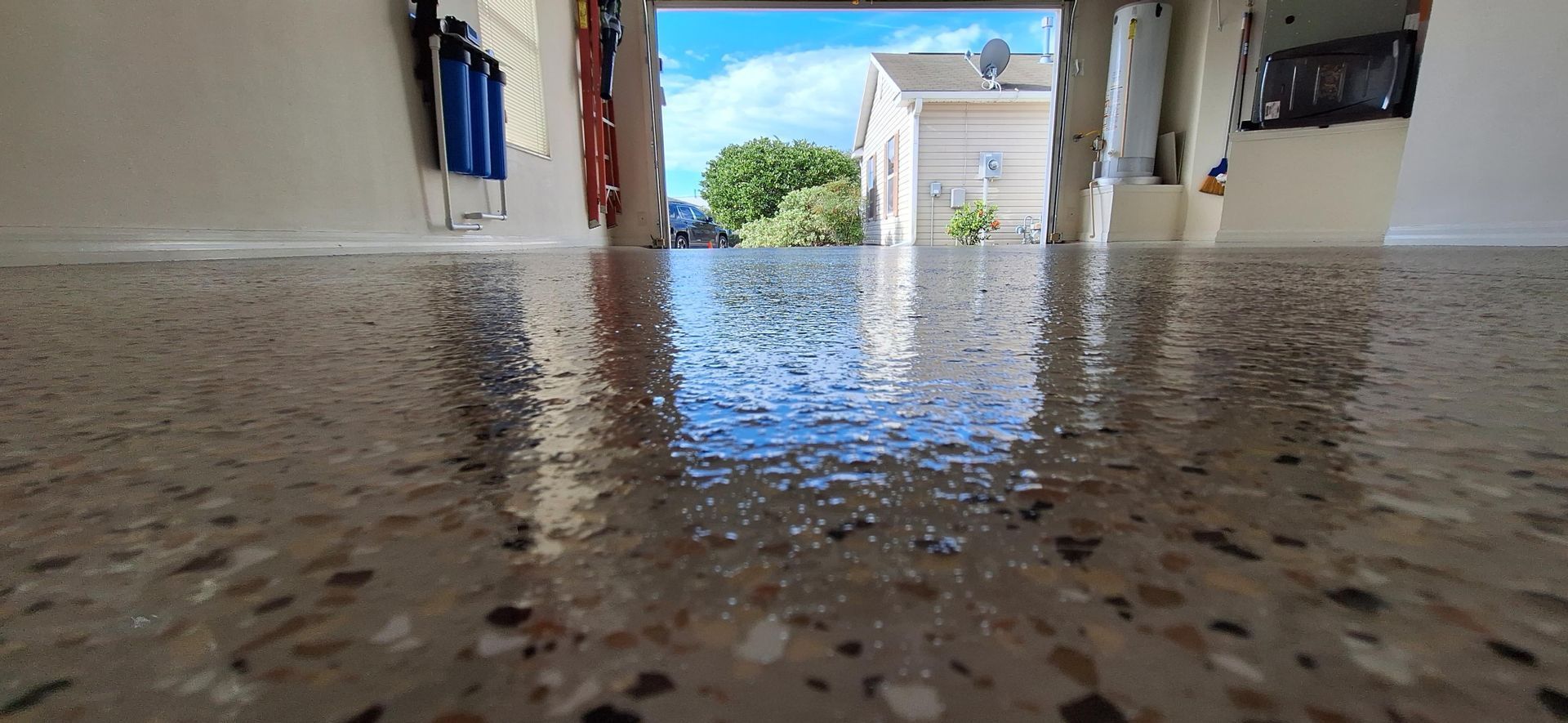 A close up of a shiny concrete floor in a garage.