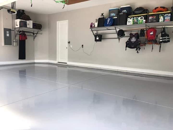 A garage with a lot of shelves and boxes on the wall.