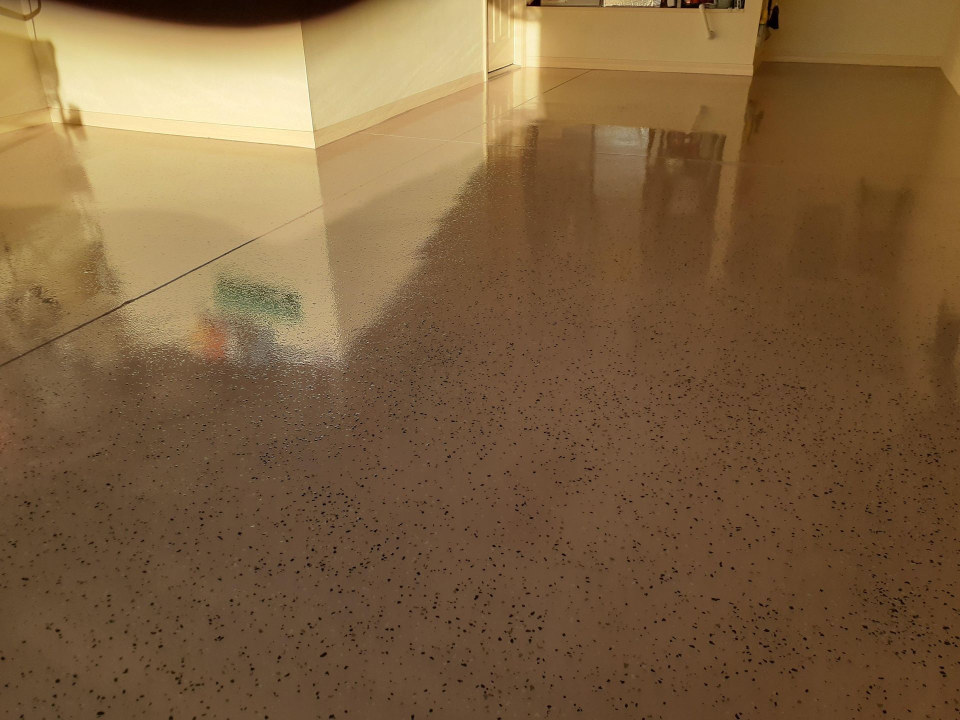 A shiny floor with a lot of small dots on it