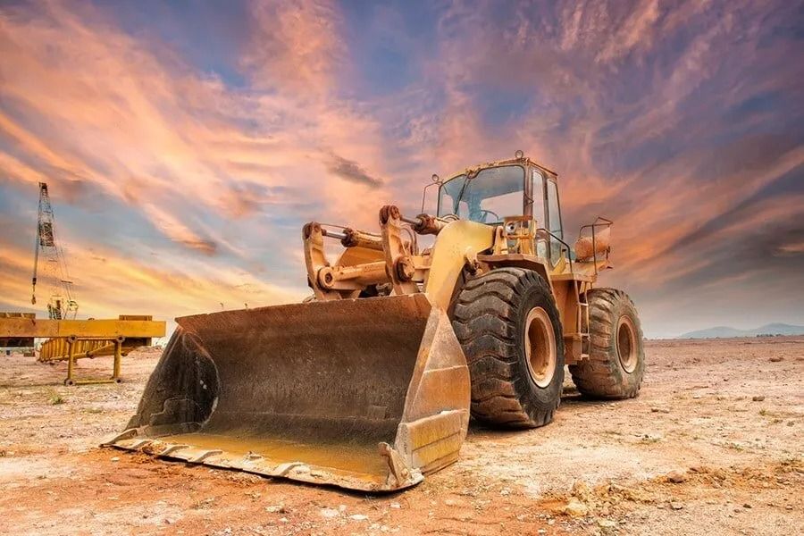 A Bulldozer is Parked in the Middle of a Dirt Field — Ensbey Earthmoving in Glenview, QLD