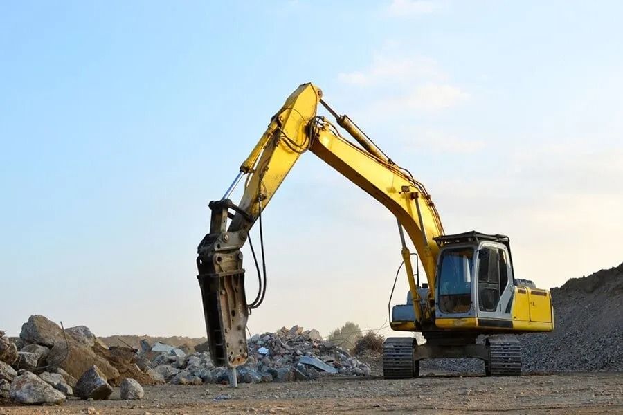 A Yellow Excavator is Working on a Construction Site — Ensbey Earthmoving in Glenview, QLD
