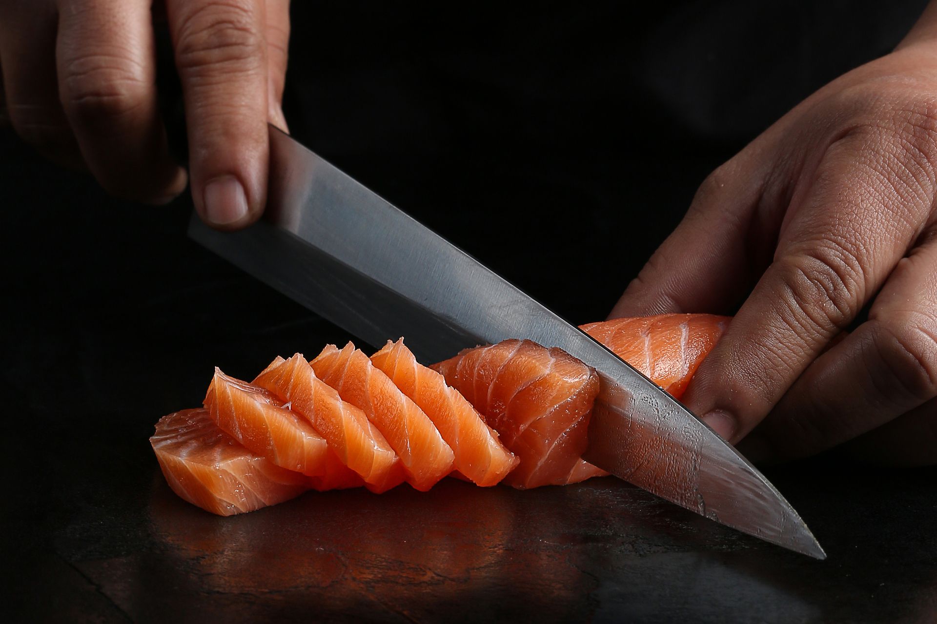 Raw salmon steaks on crushed ice at a seafood market