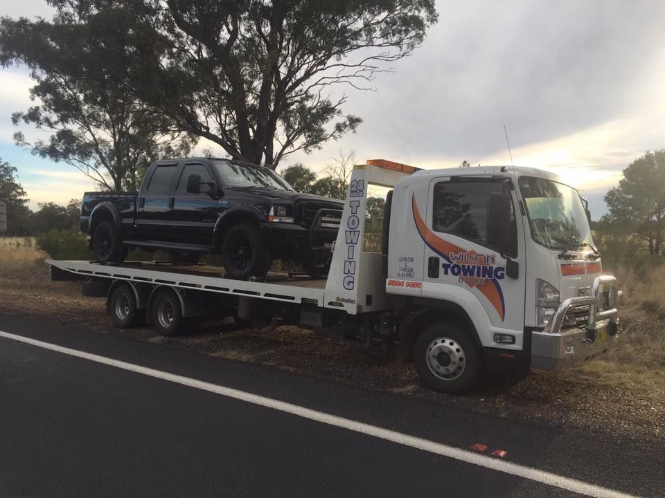 Tow truck with broken car on country road — Tow in Narromine, NSW