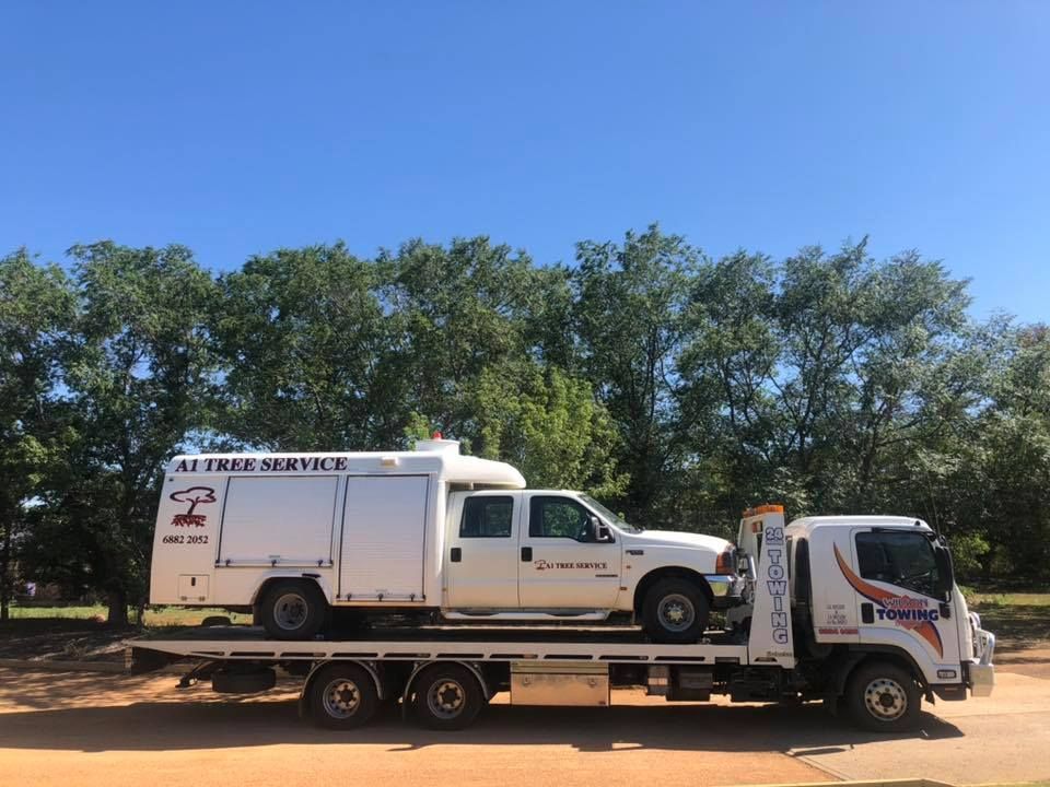Man towing damaged car away — Tow in Dubbo, NSW
