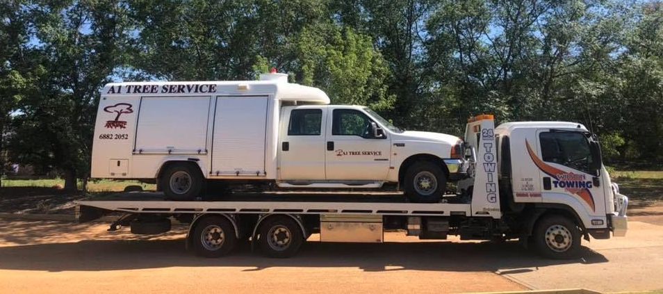 White Vehicle Car on Board in Towing Truck — Tow in Dubbo, NSW