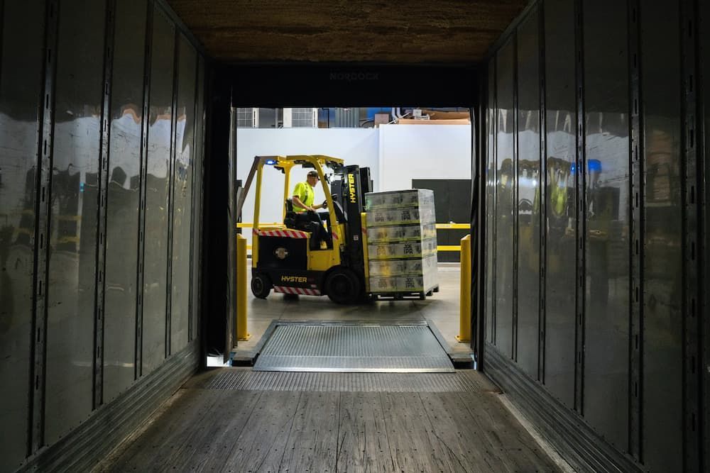 Forklift Operator Inside a Truck — Griffin Distributors In  Mount St John, QLD