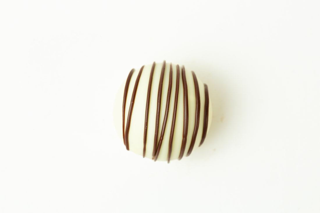 Round brown-and-white striped cookie on a white background