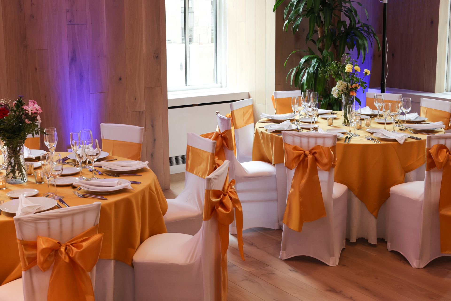 EQX City Catering Event Space at Rockefeller Center - A room with tables and chairs set up for a wedding reception