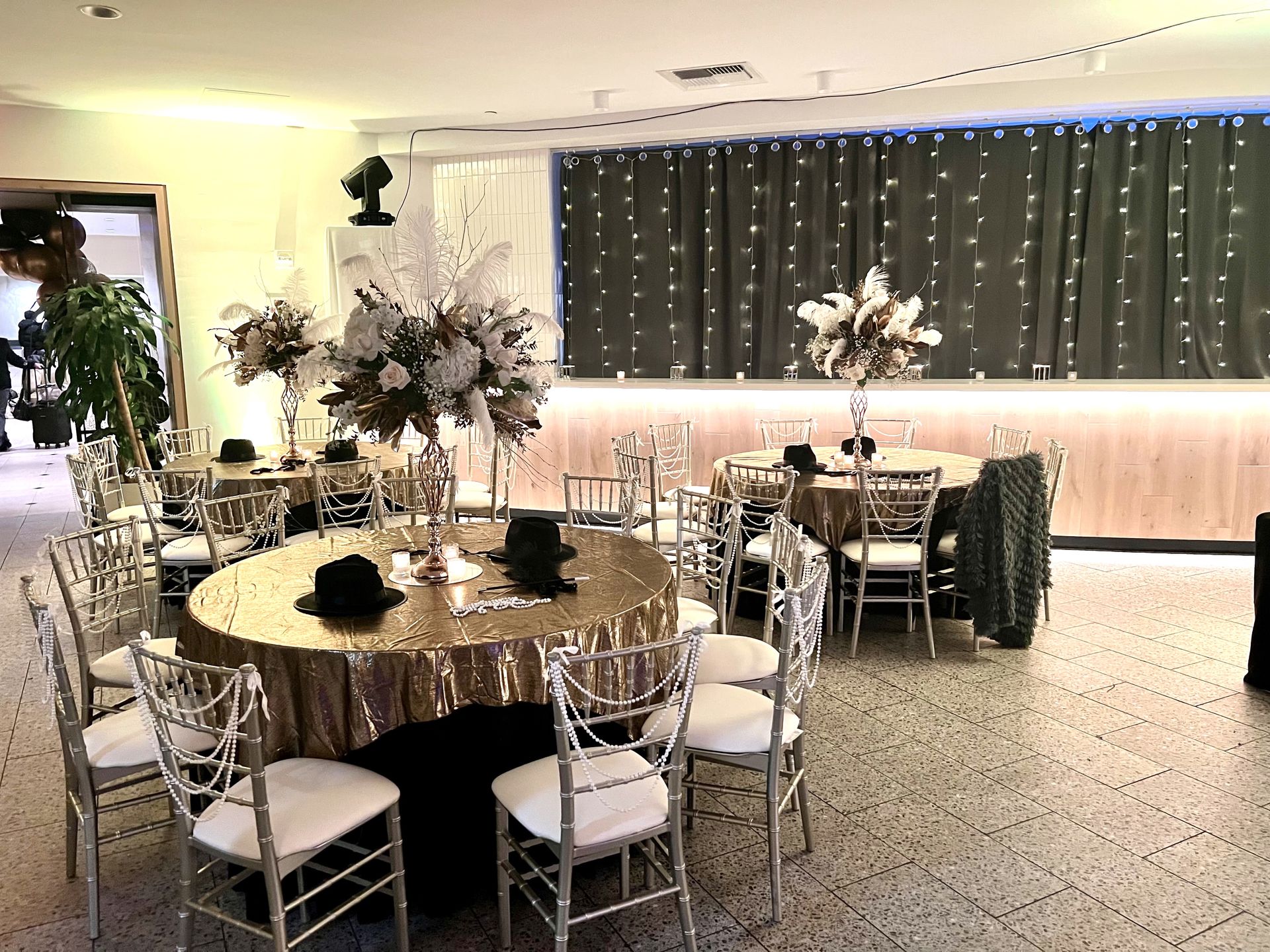 EQX City Catering Event Space at Rockefeller Center - A large room with tables and chairs set up for a wedding reception.