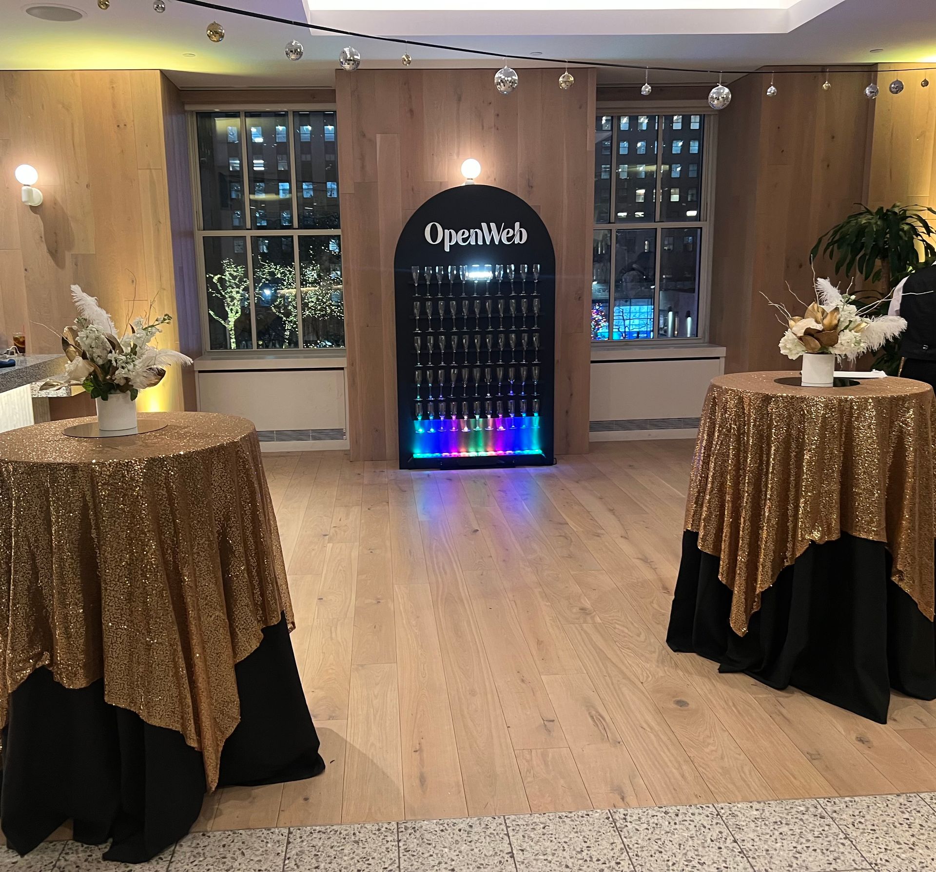 EQX City Catering Event Space at Rockefeller Center - A room with tables and a sign that says opultech