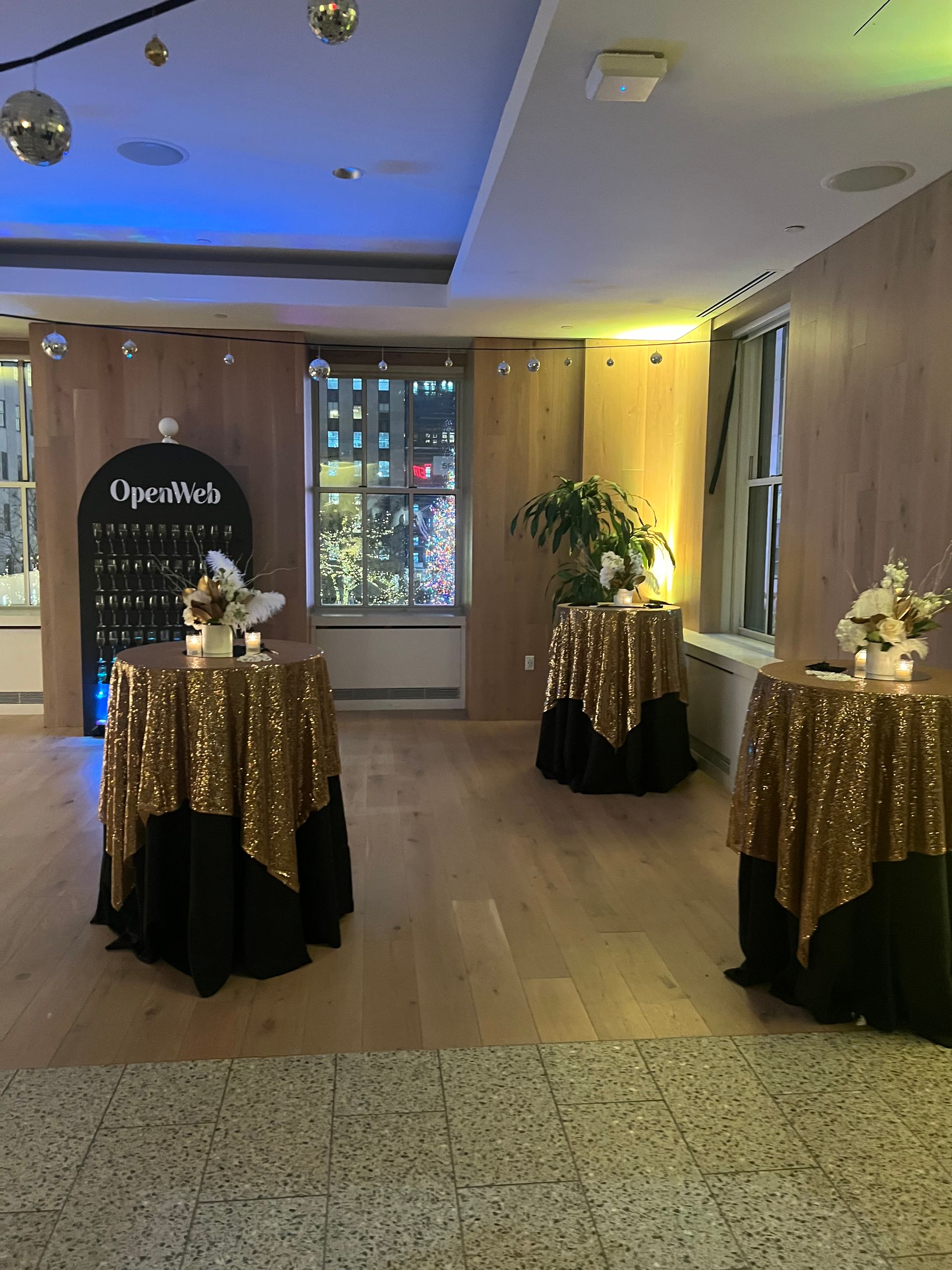 EQX City Catering Event Space at Rockefeller Center - A room with tables and a sign that says ' sherlock ' on it