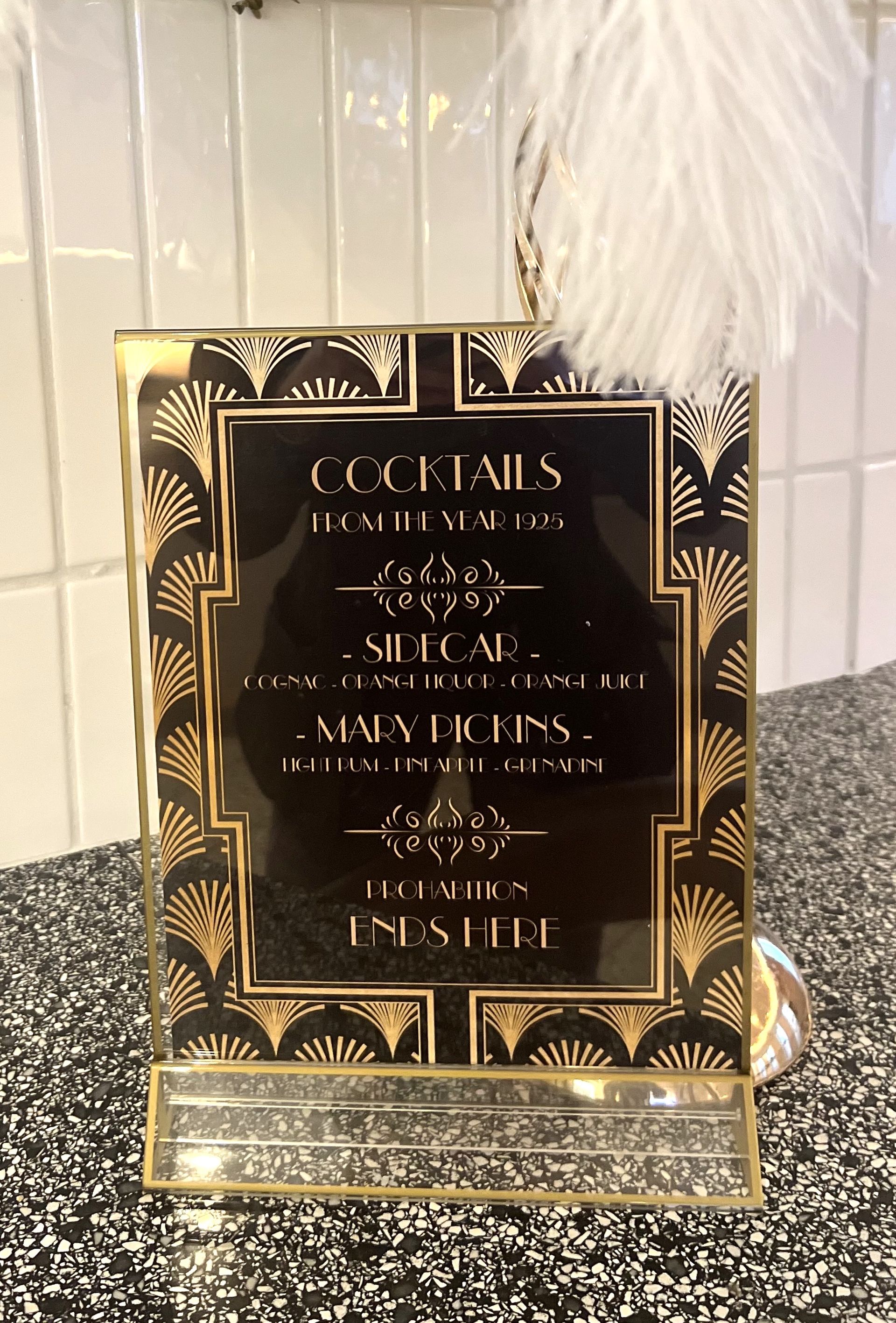 EQX City Catering Event Space at Rockefeller Center - A black and gold sign that says cocktails on it