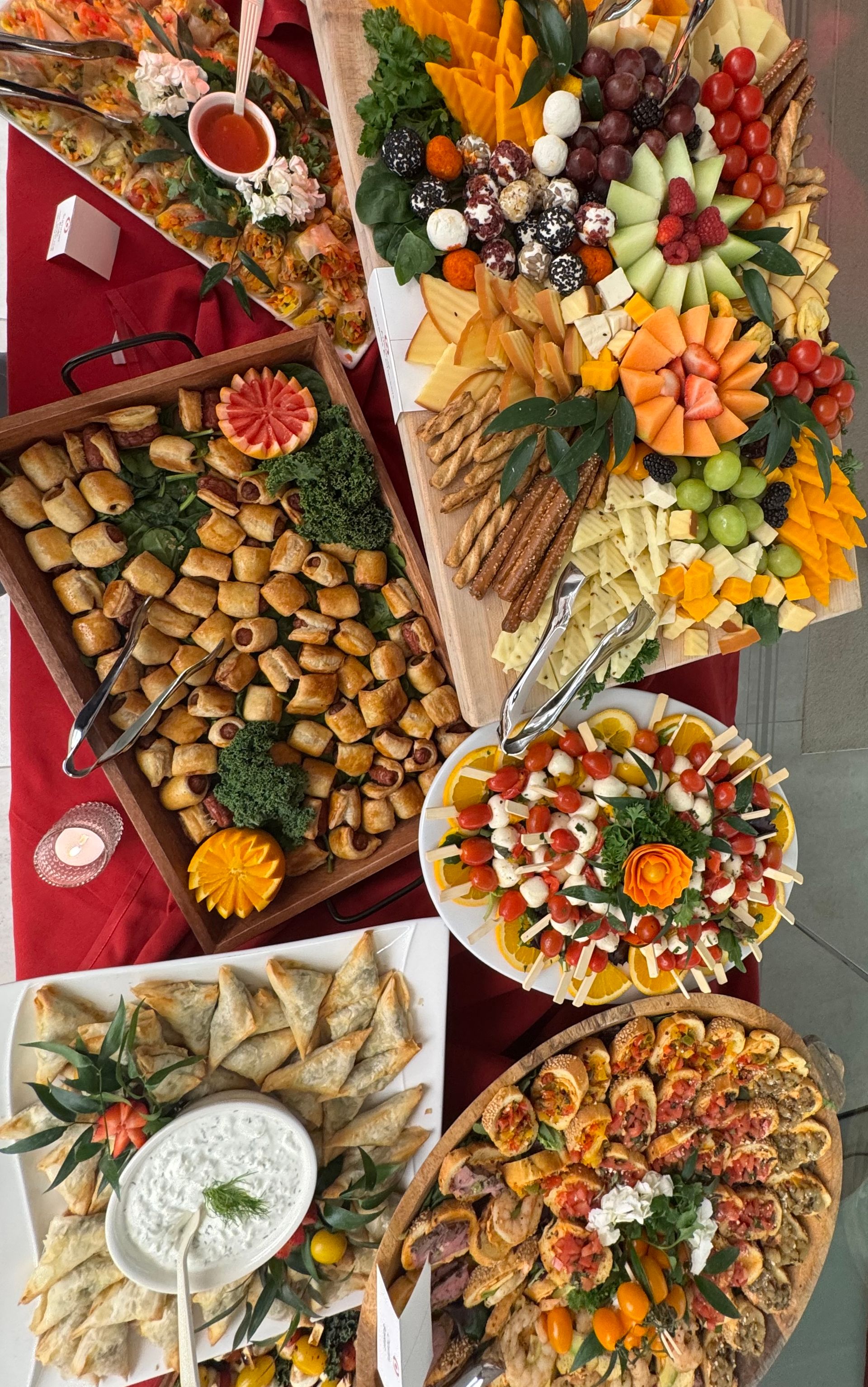 EQX City Catering Event Space at Rockefeller Center - A white plate topped with pasta and tomatoes on a table