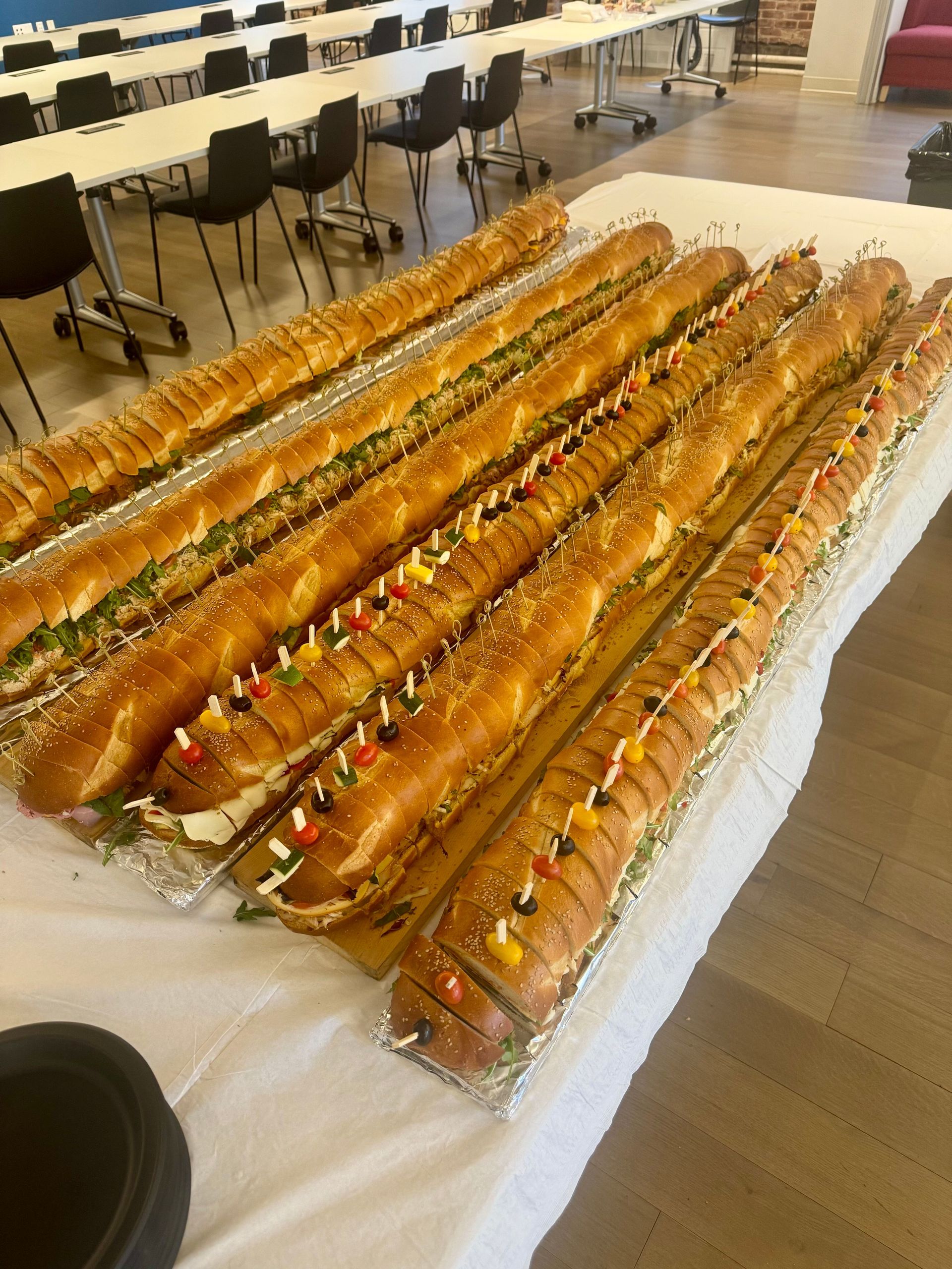 EQX City Catering Event Space at Rockefeller Center - A tray of food with a bowl of dipping sauce and a vase of flowers in the background.