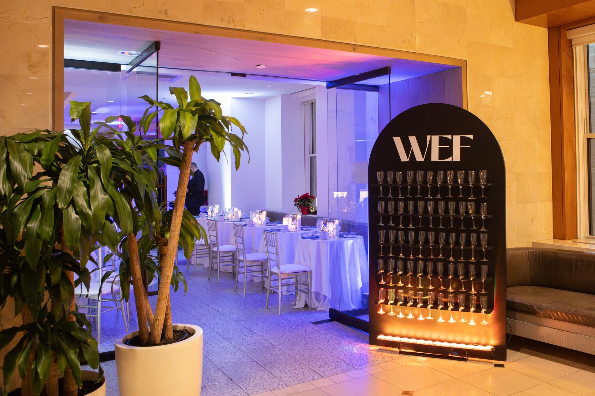 EQX City Catering Event Space at Rockefeller Center - A buffet table with a bottle of champagne and a bottle of wine.