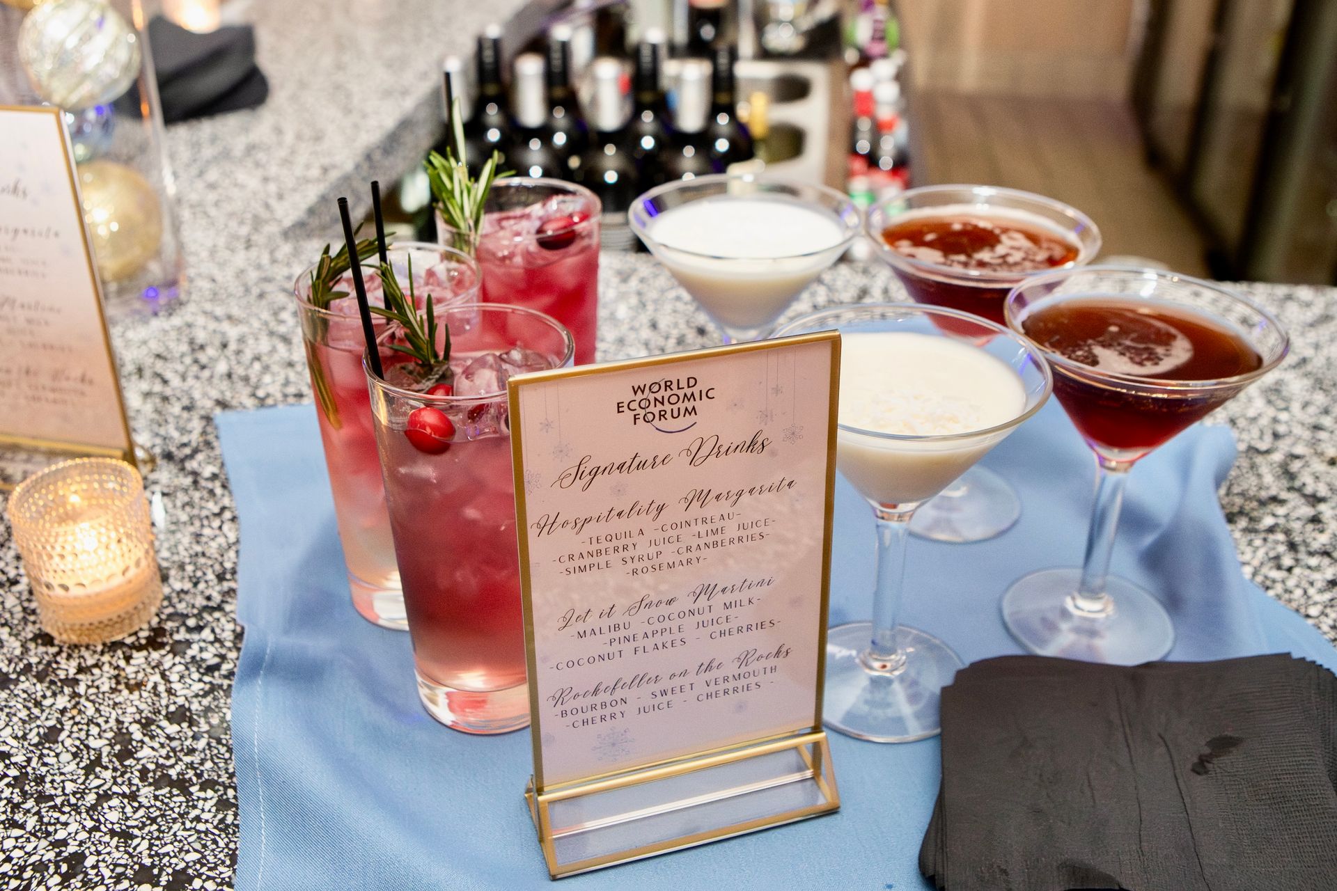 EQX City Catering Event Space at Rockefeller Center - A bartender is pouring a drink into a martini glass.