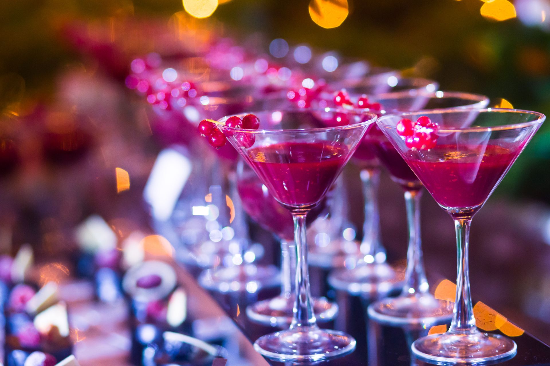EQX City Catering Event Space at Rockefeller Center - A row of martini glasses filled with purple liquid.