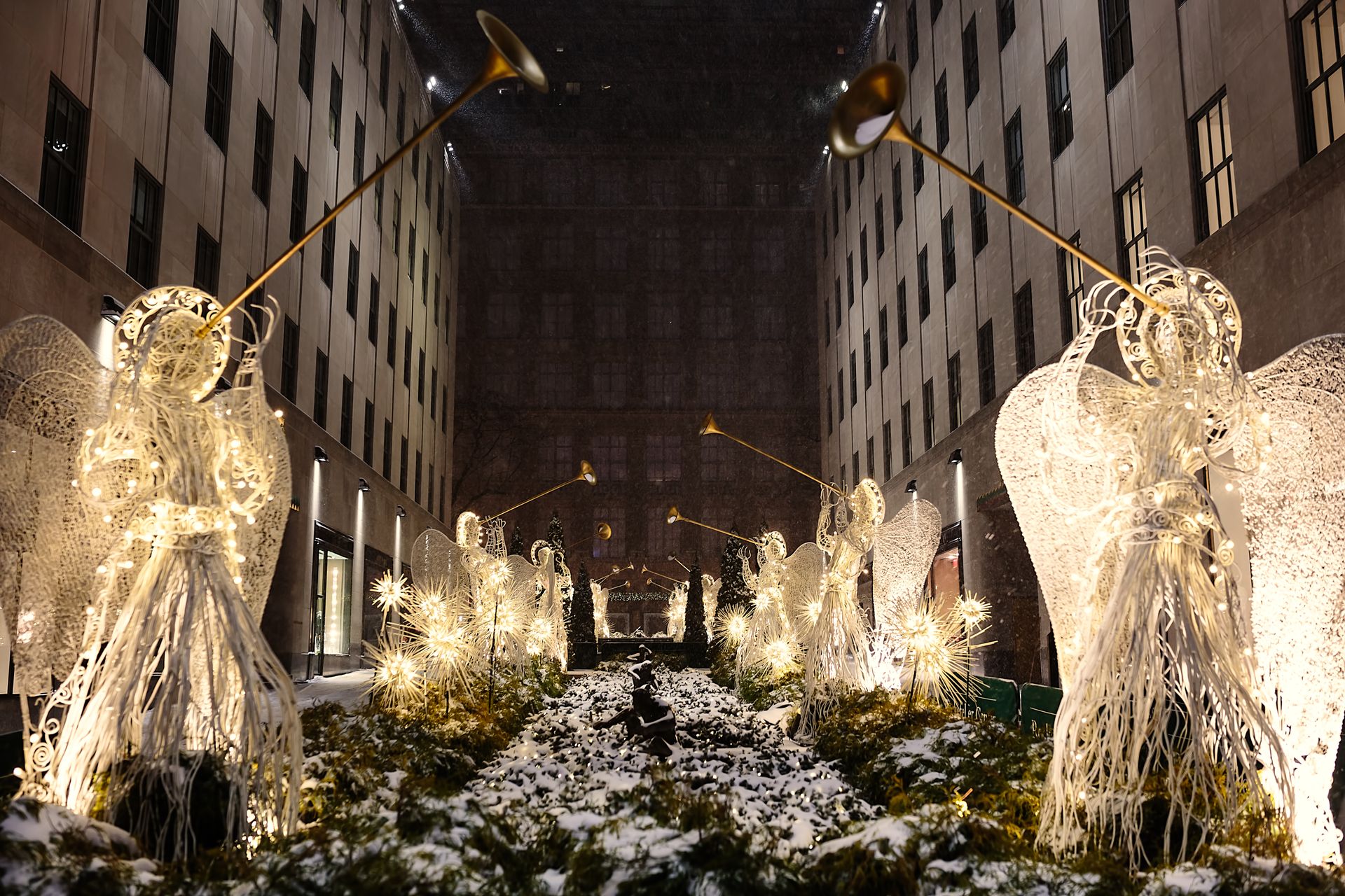 EQX City Catering Event Space at Rockefeller Center - A row of angels are lit up in front of a building