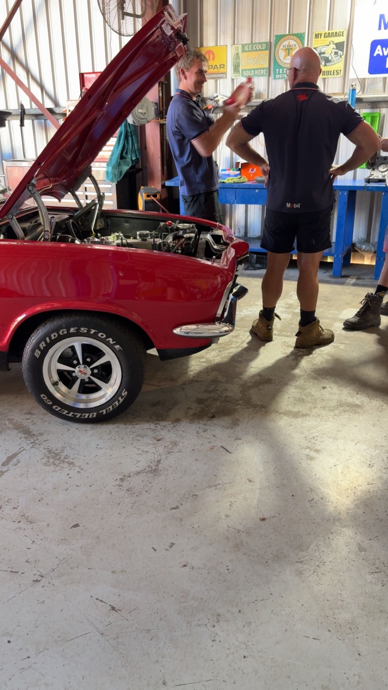 Red Car in a Garage With Hood Open — Fischer Automotive in Svensson Heights, QLD
