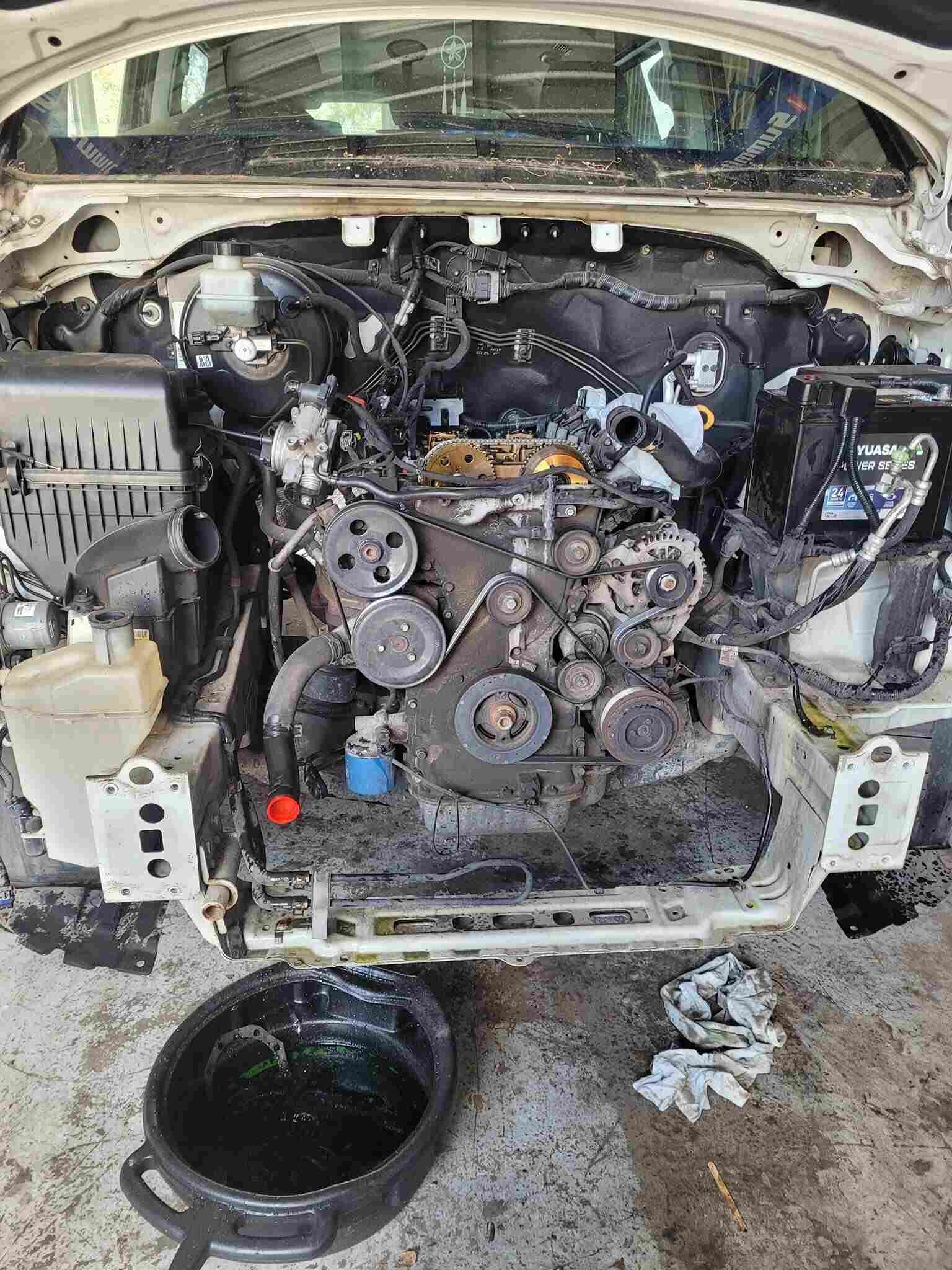 Local Mechanic Bundaberg Inspecting Vehicle Engine Components