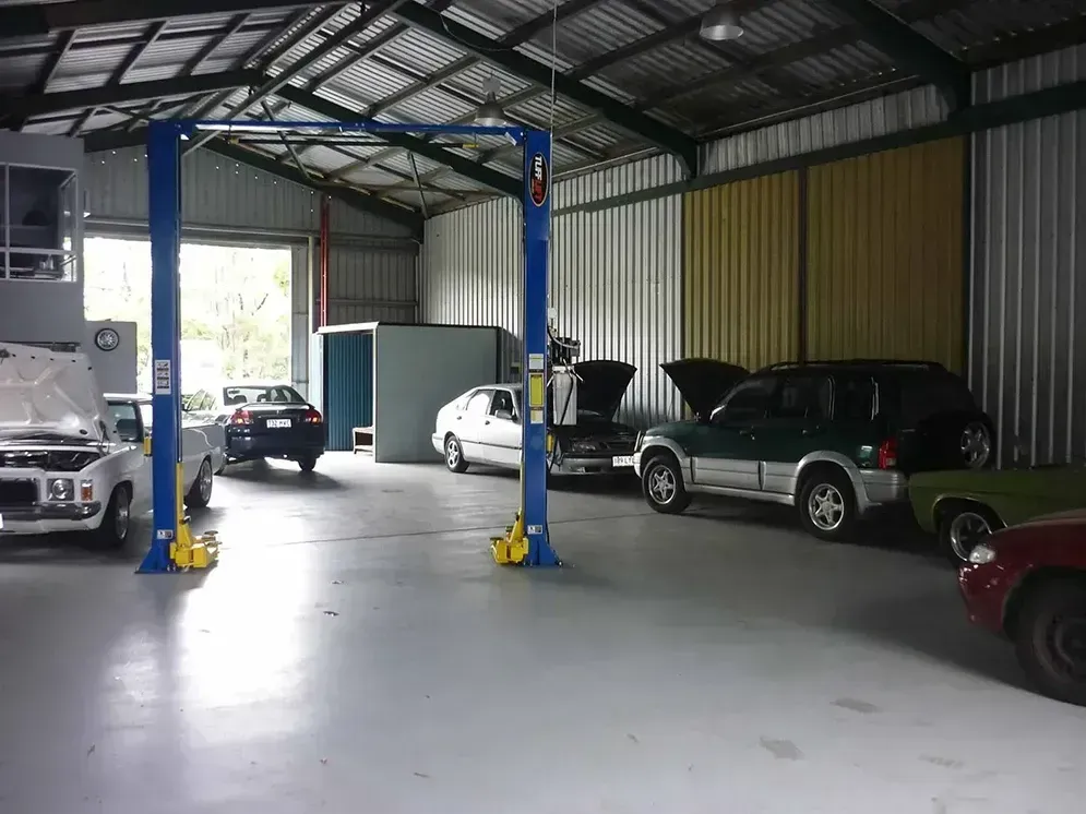 Covered Car Garage With Several Parked Vehicles — Fischer Automotive in Svensson Heights, QLD