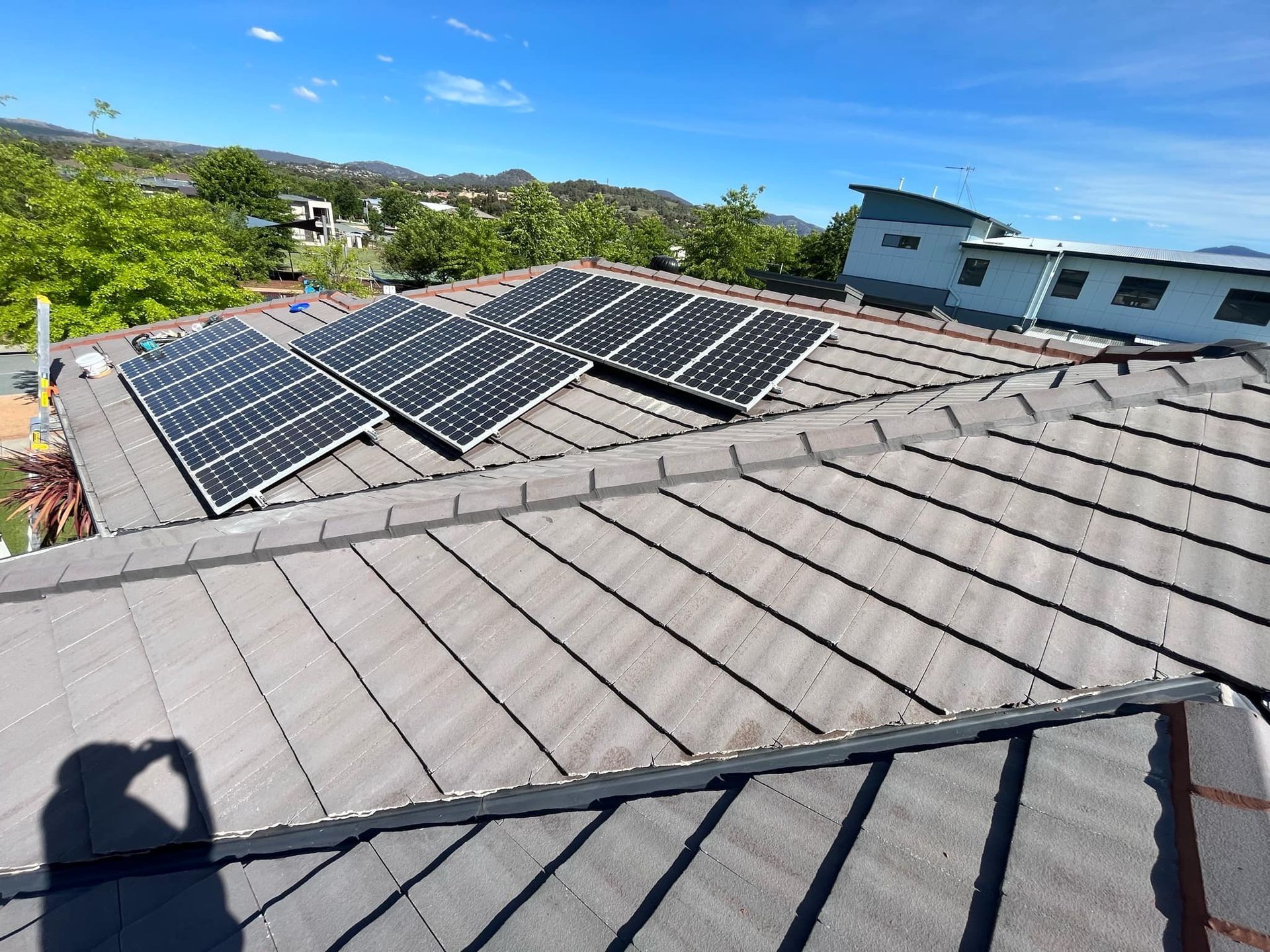 A roof with a lot of solar panels on it — RJT Roofing In Gungahlin, ACT