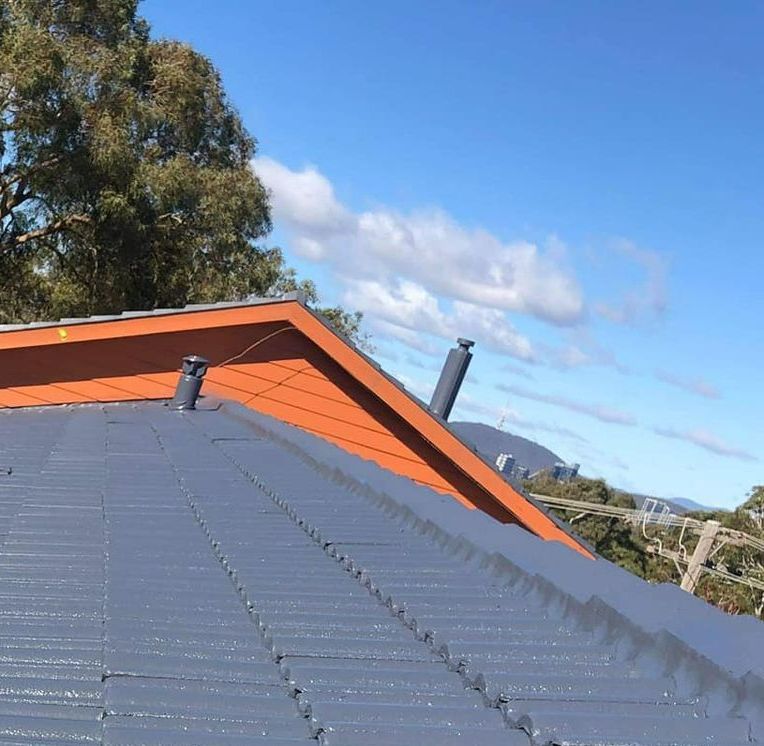 A Close Up of a Roof With a Blue Sky in the Background — RJT Roofing In Bonner, ACT