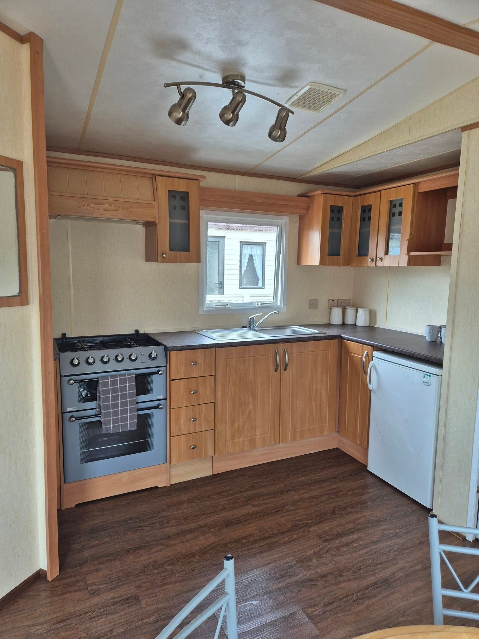 Kitchen area within a 2 bedroom ABI Brisbane holiday home for sale by Cotswold Grange Country Park