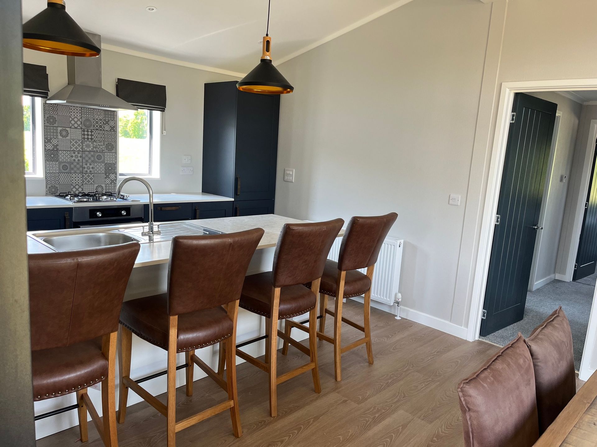 Open plan kitchen and dining area inside the Tingdene Park Home for sale at Cotswold Grange Country Park