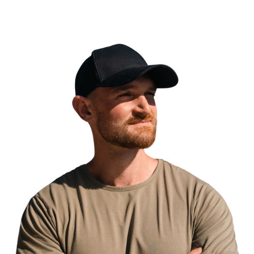 A man with a beard wearing a black baseball cap