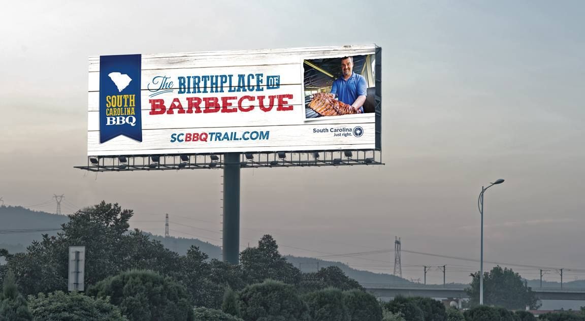 Billboard for South Carolina BBQ Trail, featuring a cook with food. Website address: SCBBQtrail.com.