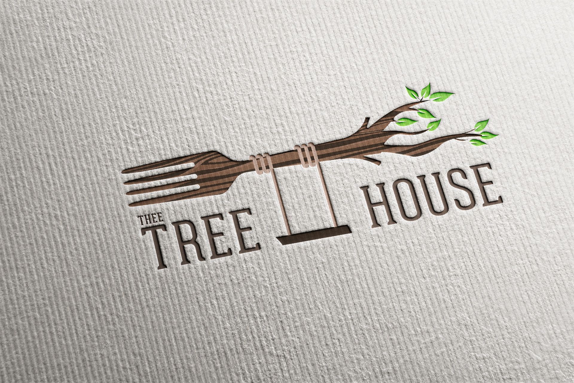Logo for The Tree House restaurant: fork-shaped tree branch with swing, brown and green.
