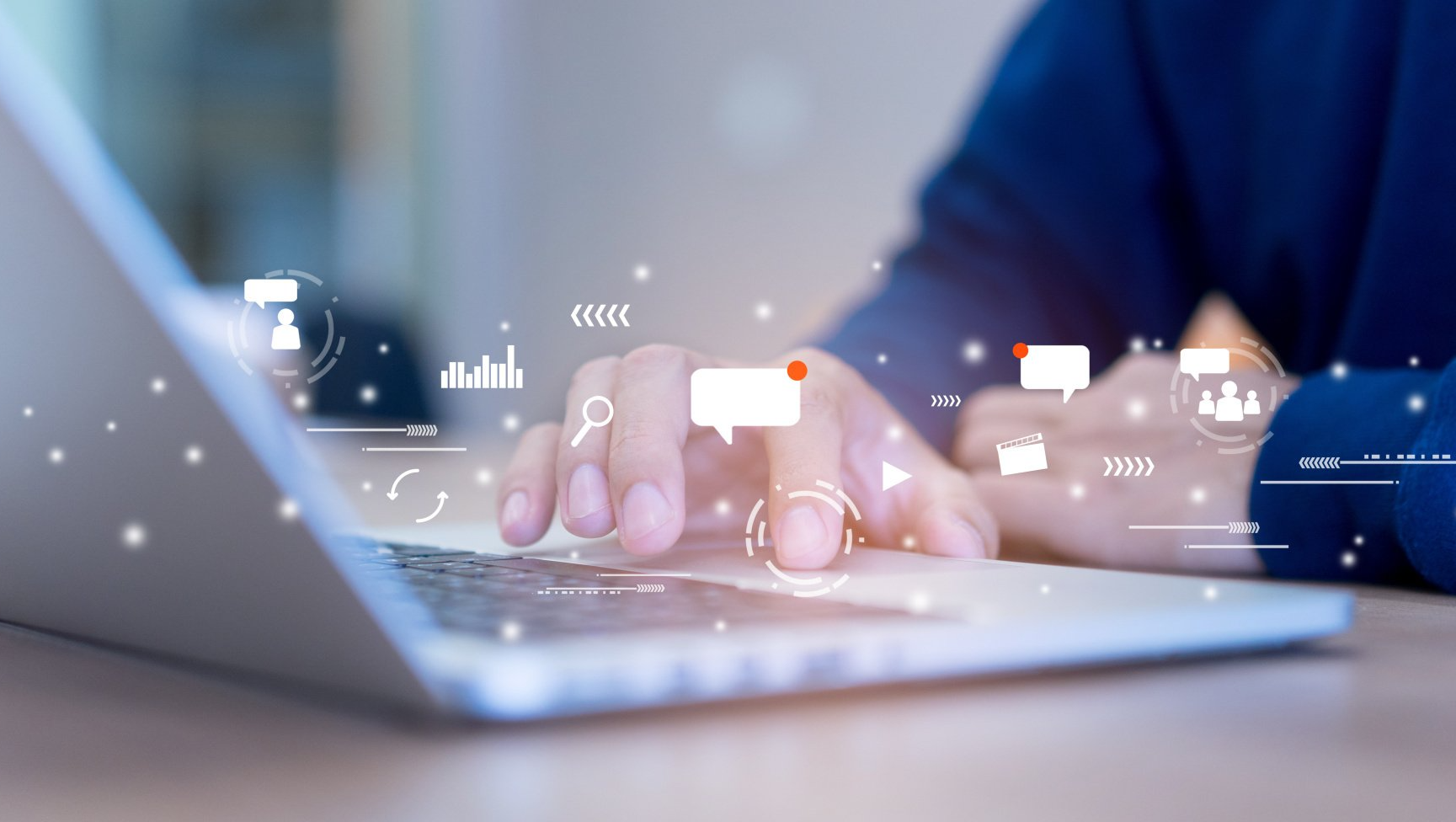 Person using a laptop, interacting with digital icons representing data, communication, and business.