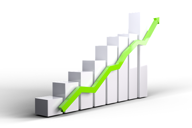 White bar graph with green upward-trending arrow, indicating growth.
