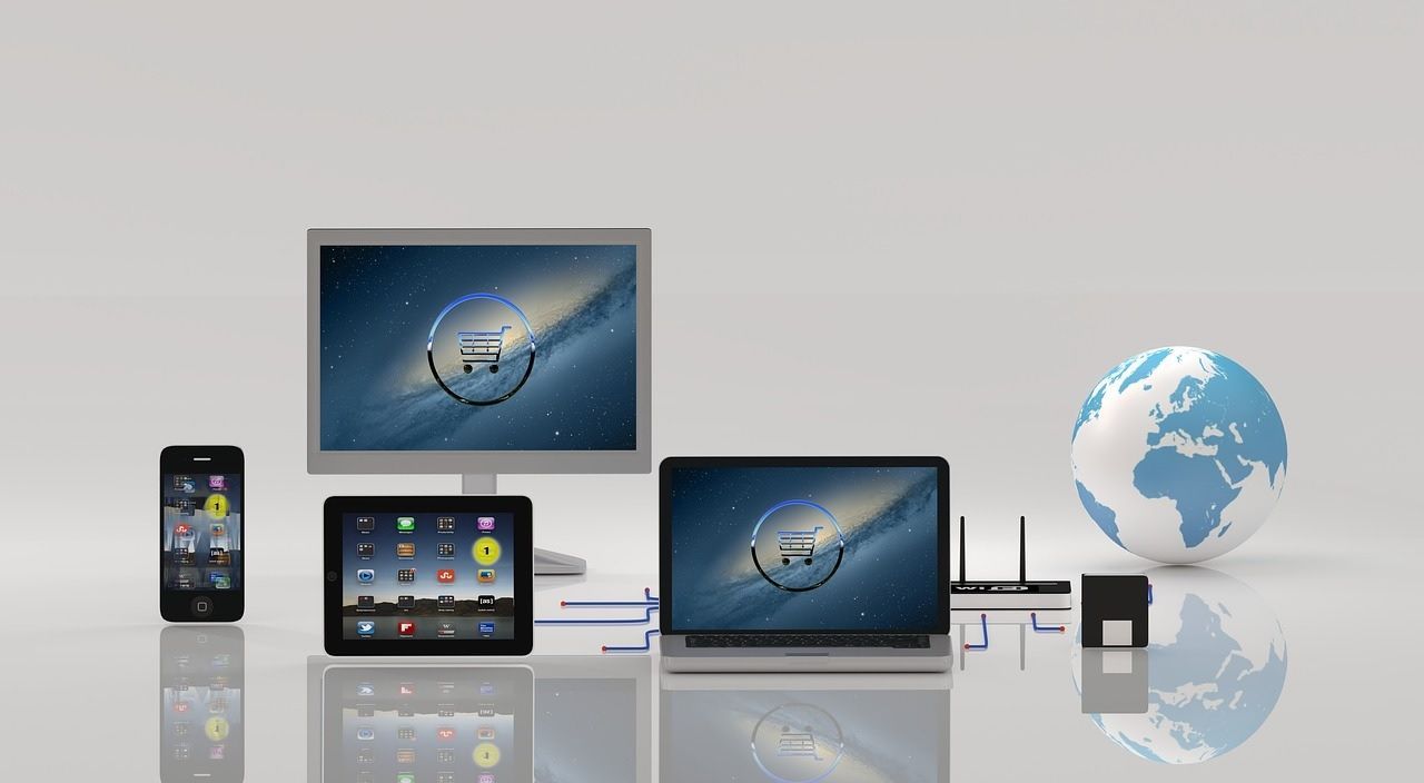 Devices connected, including phone, tablet, desktop, laptop, and globe, against a white backdrop.