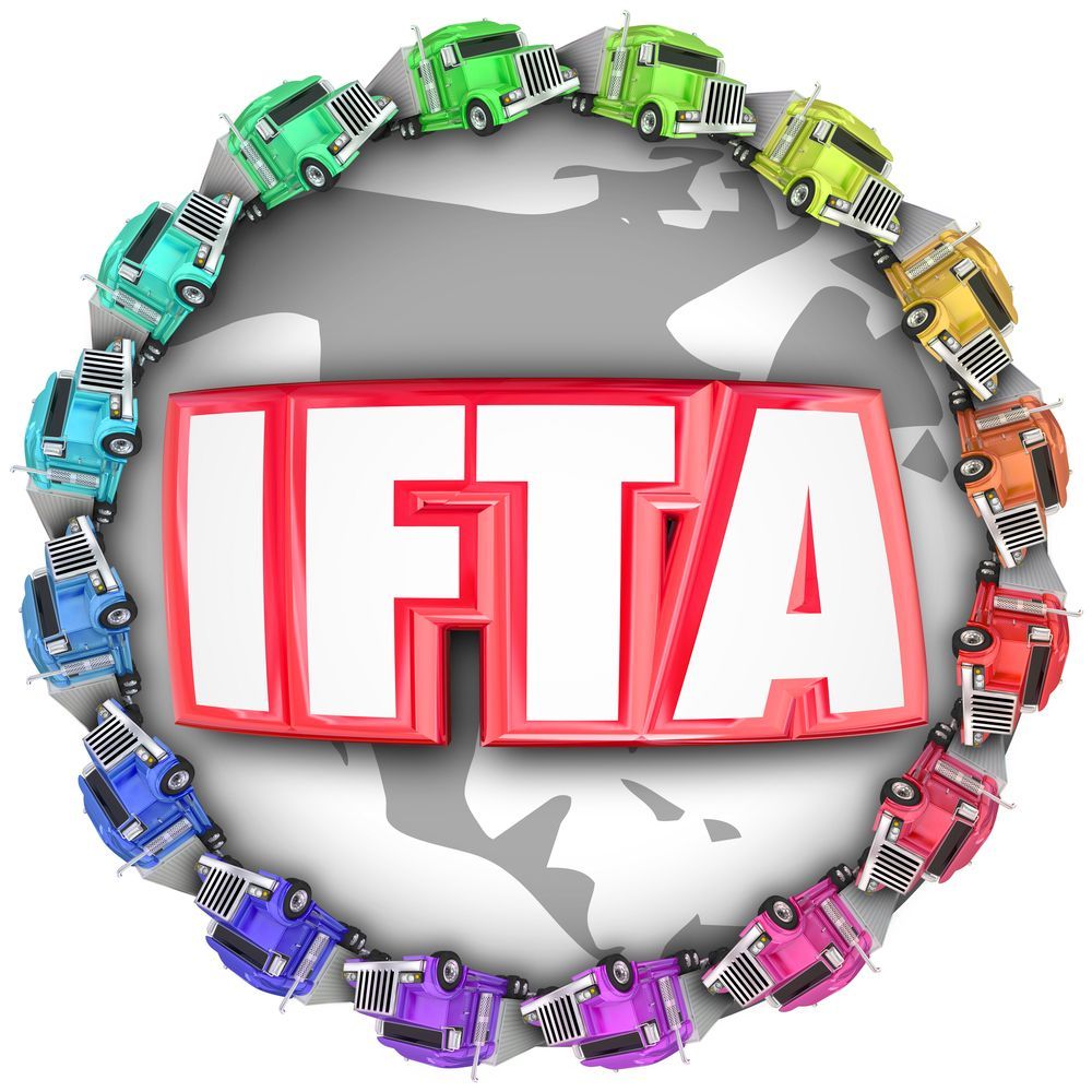IFTA logo in white and red on a gray globe, surrounded by colorful trucks in a circle