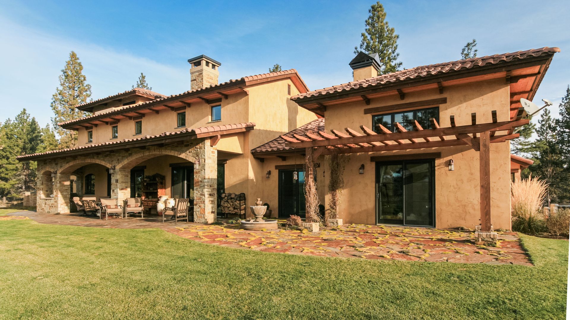 a large house with a large lawn in front of it .
