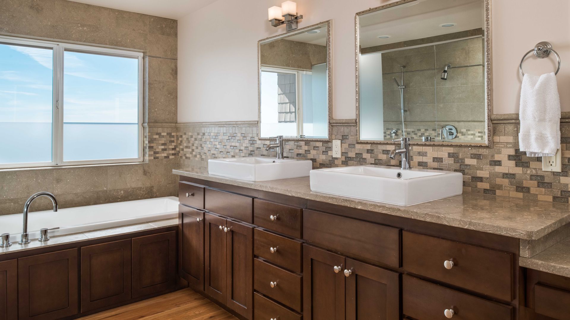 vanity with soaking tub next to it