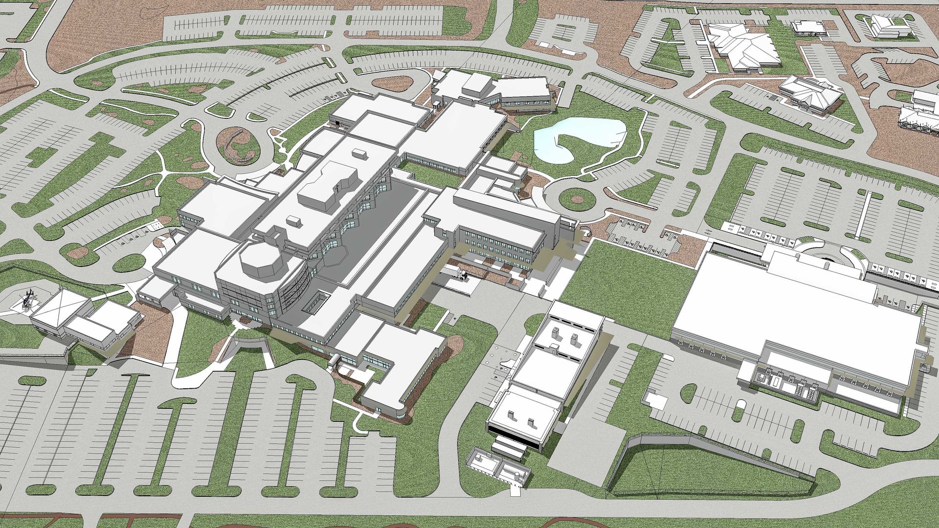 an aerial view of a large building surrounded by parking lots