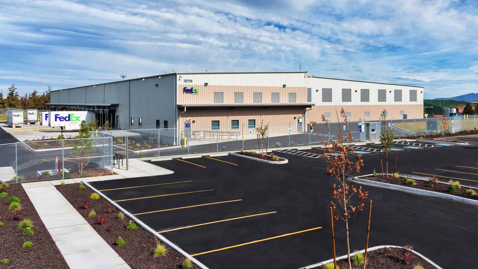 a large building with a fedex truck parked in front of it