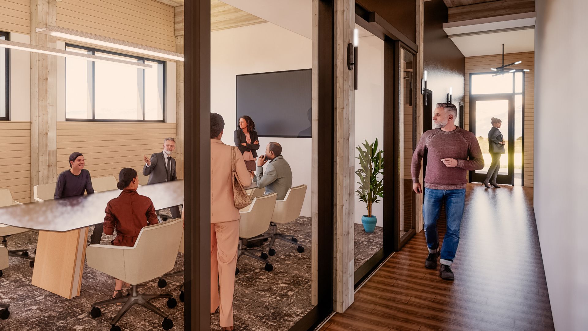 a group of people are sitting at a table in a conference room .