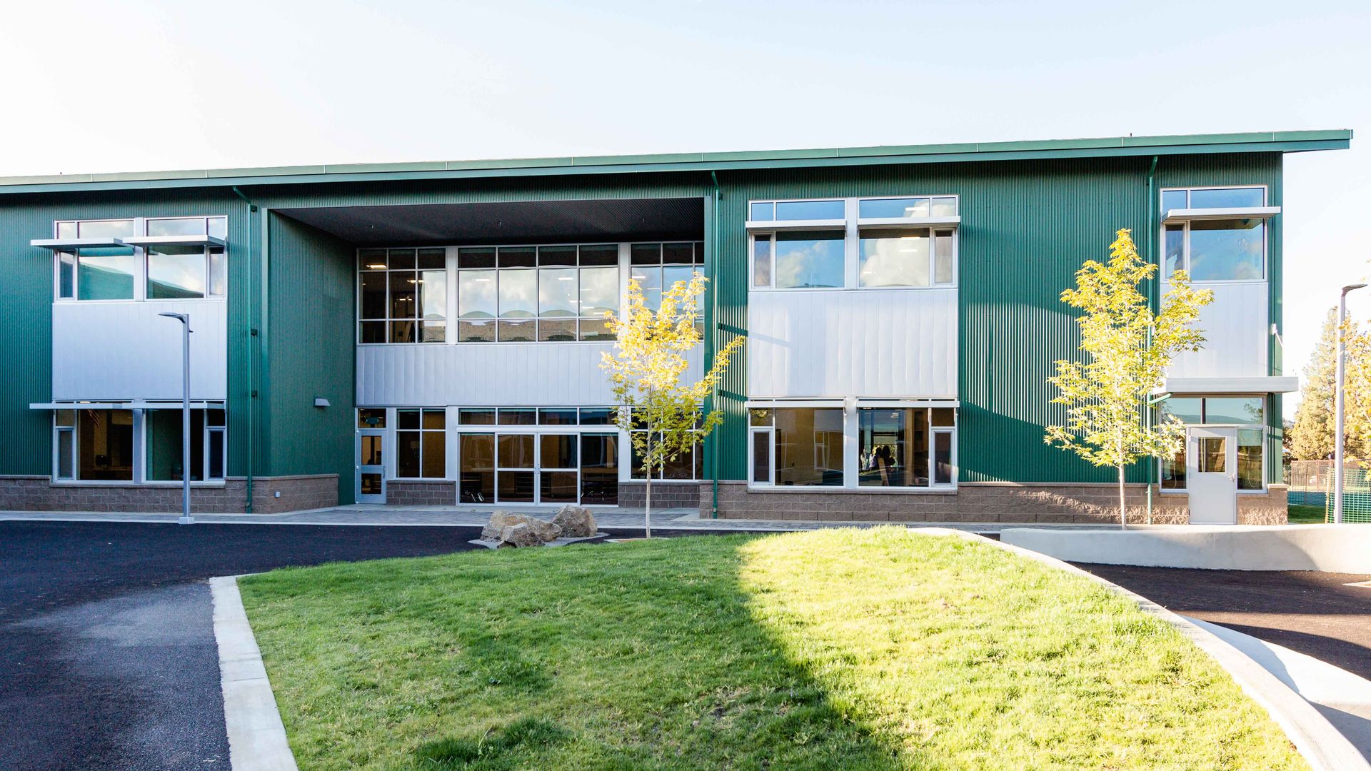 Interior and exterior photos of silver nail elementary school designed by steel associates