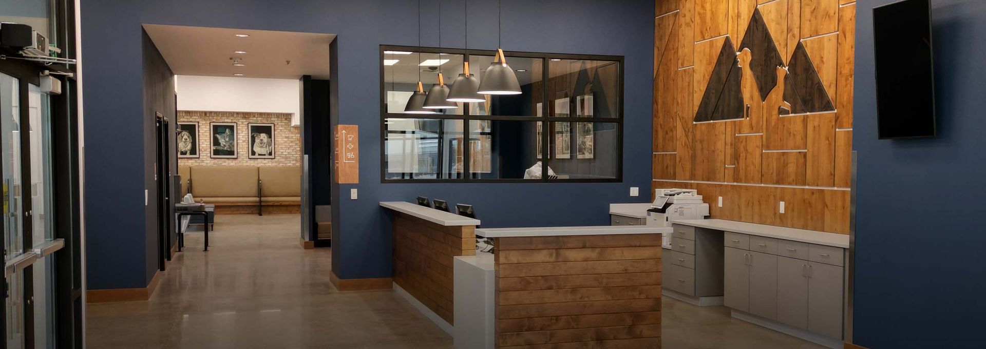 There is a reception desk in the middle of the room.