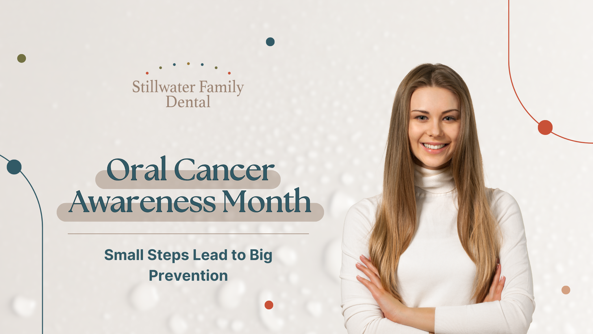 A woman is smiling with her arms crossed for oral cancer awareness month.